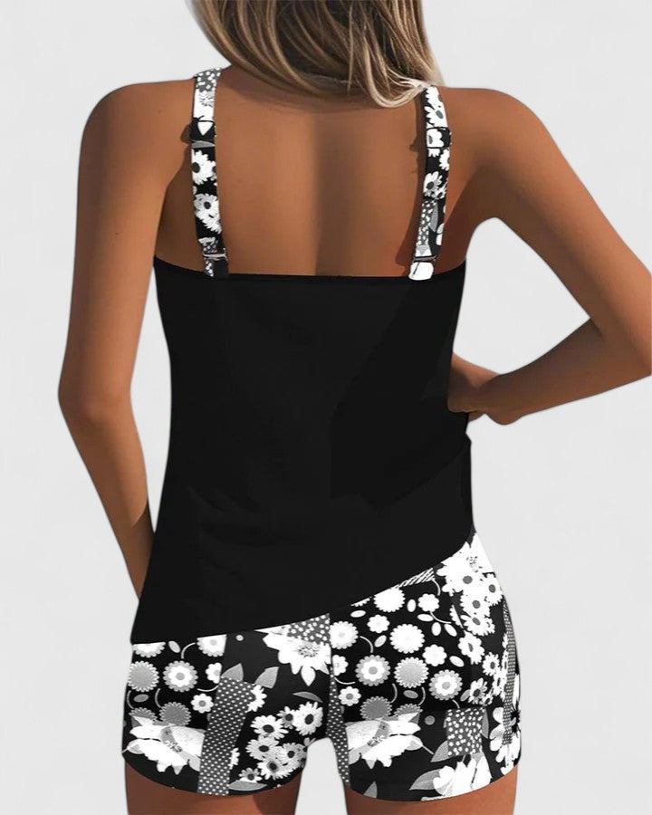 A woman wearing a comfortable swimsuit with a lively print, relaxed and carefree by the pool.
