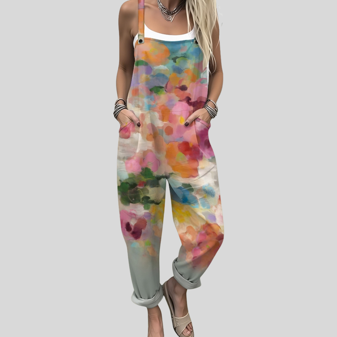 Muireann™ relaxed dungarees with an all-over abstract watercolour splash print in pink, orange, blue, green, yellow and lilac covering the entire garment.