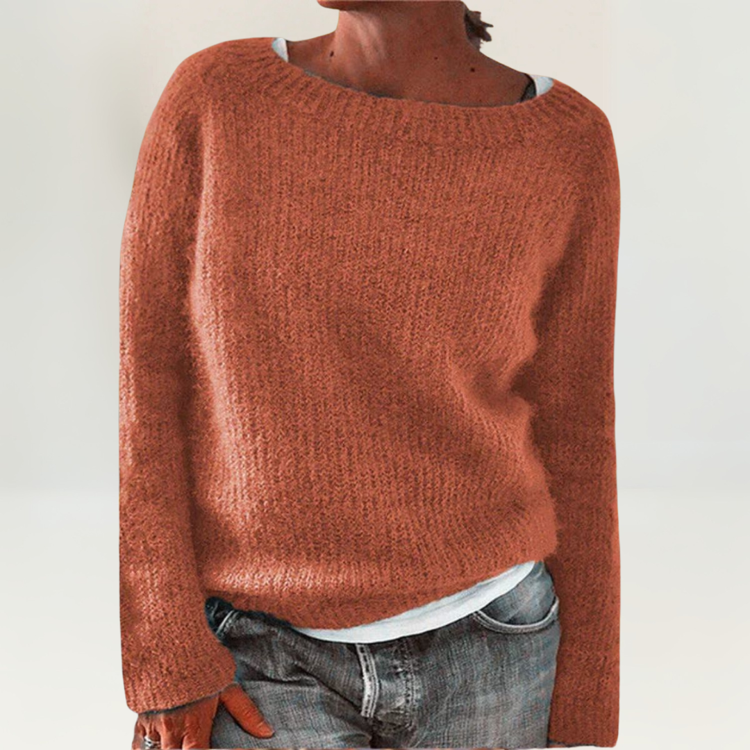 A woman wearing a soft, relaxed everyday jumper, comfortable and elegant with jeans.