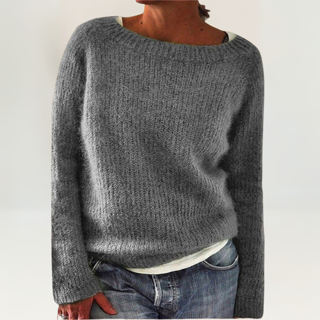 A woman wearing a soft, relaxed everyday jumper, comfortable and elegant with jeans.