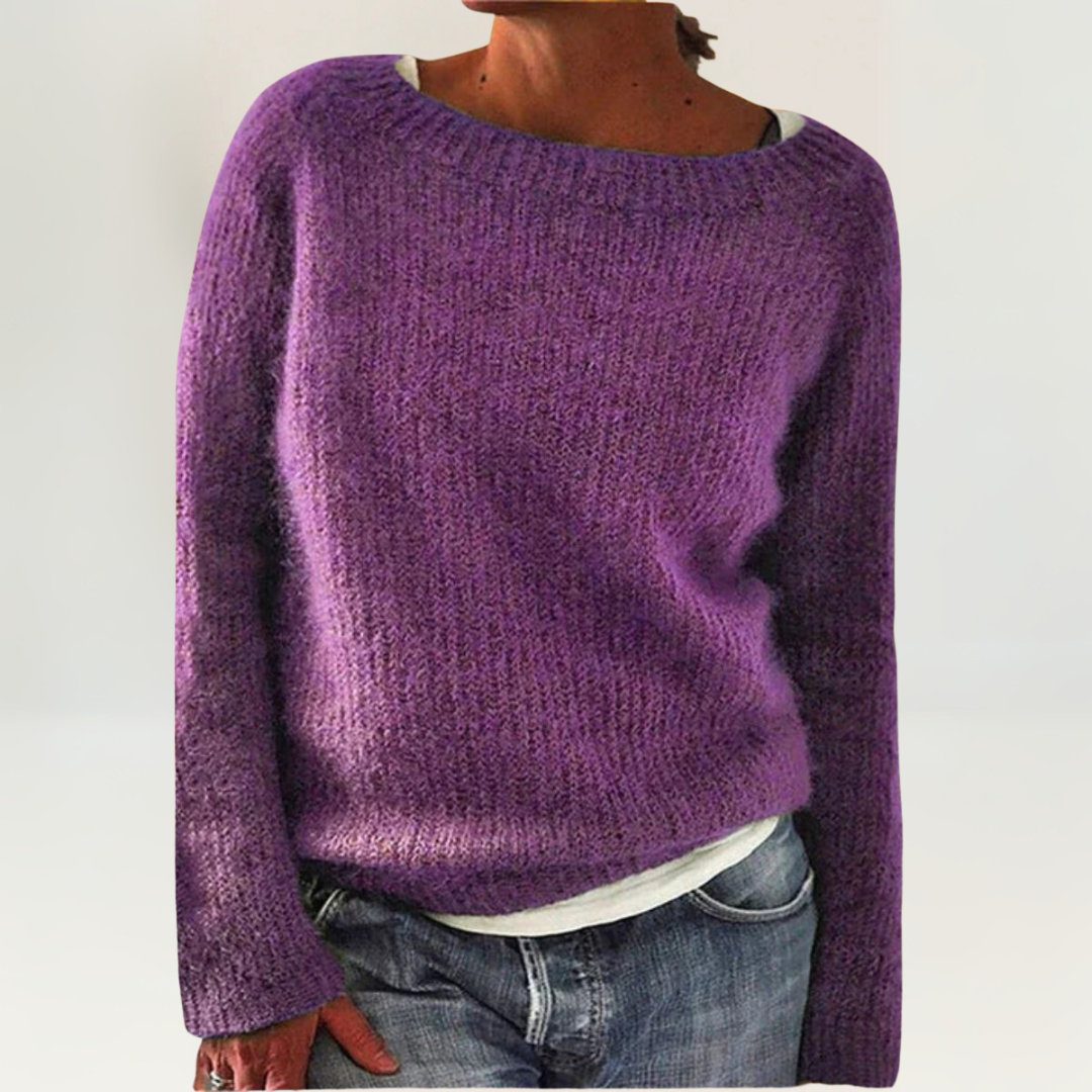 A woman wearing a soft, relaxed everyday jumper, comfortable and elegant with jeans.