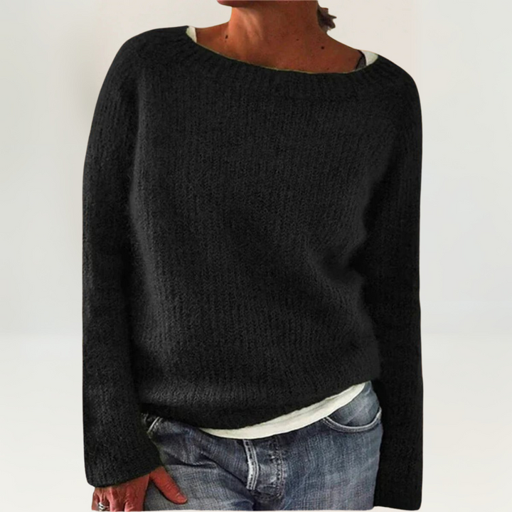 A woman wearing a soft, relaxed everyday jumper, comfortable and elegant with jeans.