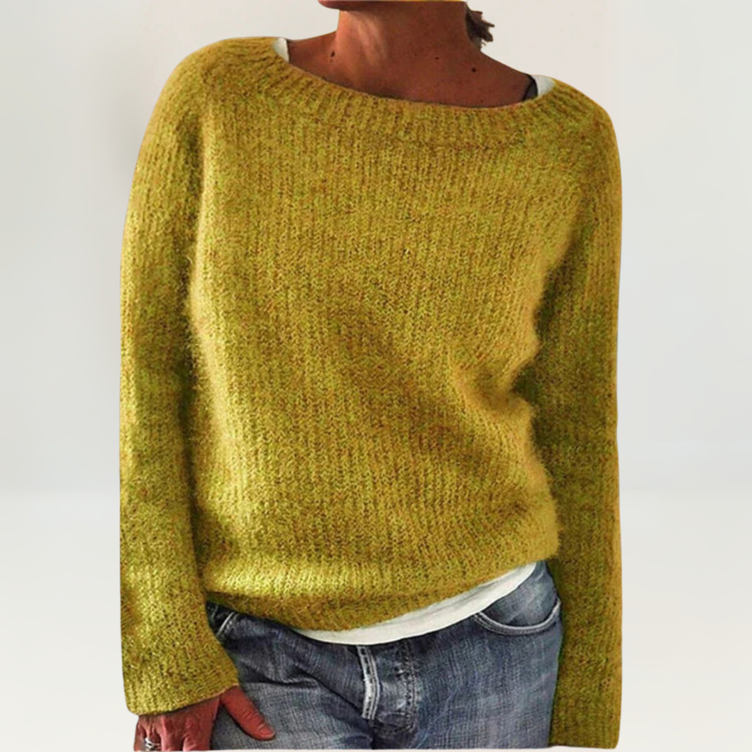 A woman wearing a soft, relaxed everyday jumper, comfortable and elegant with jeans.
