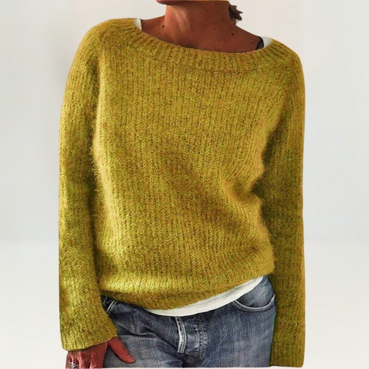 A woman wearing a soft, relaxed everyday jumper, comfortable and elegant with jeans.