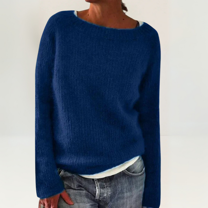 A woman wearing a soft, relaxed everyday jumper, comfortable and elegant with jeans.