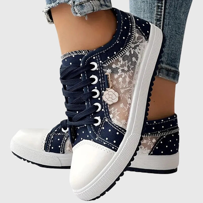 A woman walking comfortably in blue cushioned orthopaedic trainers