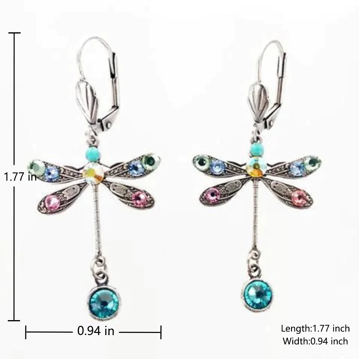 A pair of delicate drop earrings shaped as butterflies in a fine metal finish