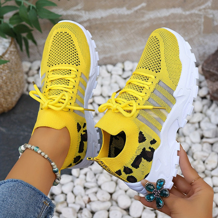 A woman walking in light, breathable comfort trainers on a warm day.