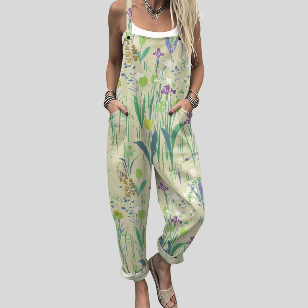 Wide-leg light dungarees with a watercolour meadow blossom print in green and lilac, adjustable straps, from Mary Cork Ireland.