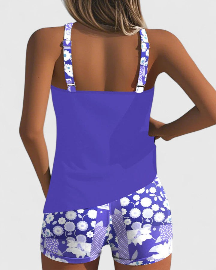 A woman wearing a comfortable swimsuit with a lively print, relaxed and carefree by the pool.