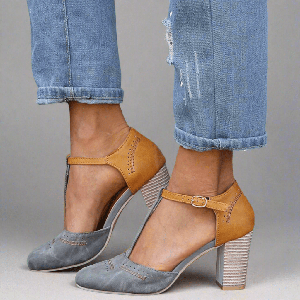 A woman wearing light grey everyday heels, walking comfortably through her day.