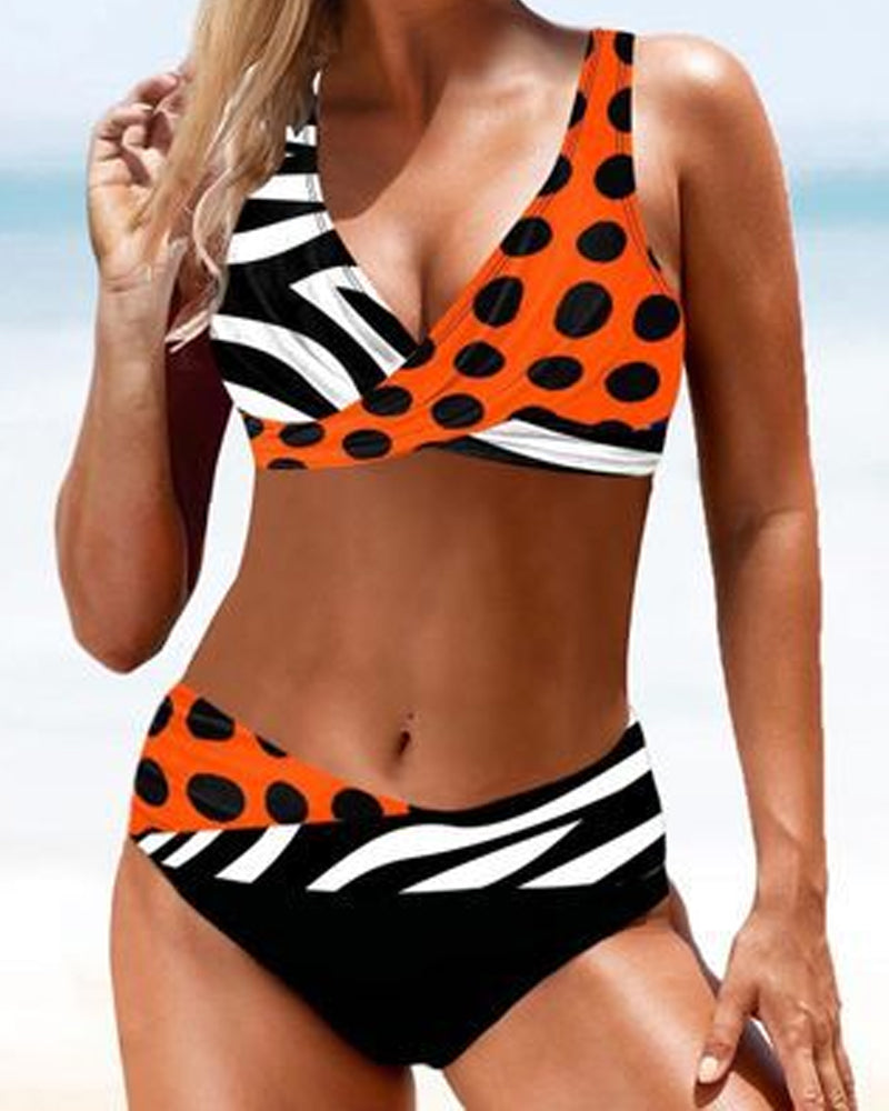 Fuchsia and multicolour crossover bikini with a V-neckline top and colourful bottoms