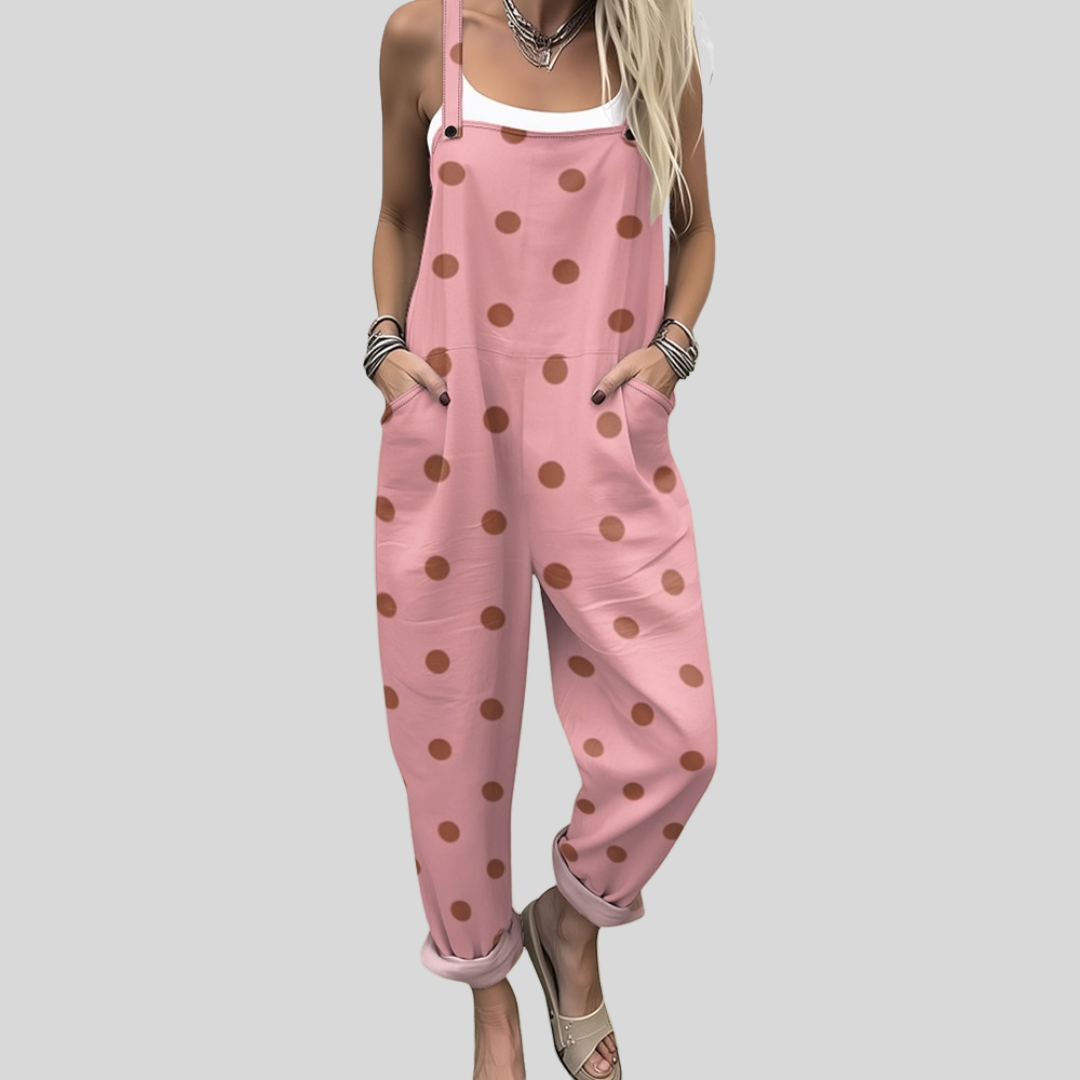 Caoilfhionn™ relaxed tapered dungarees in soft blush pink with evenly-sized warm terracotta polka dots throughout.
