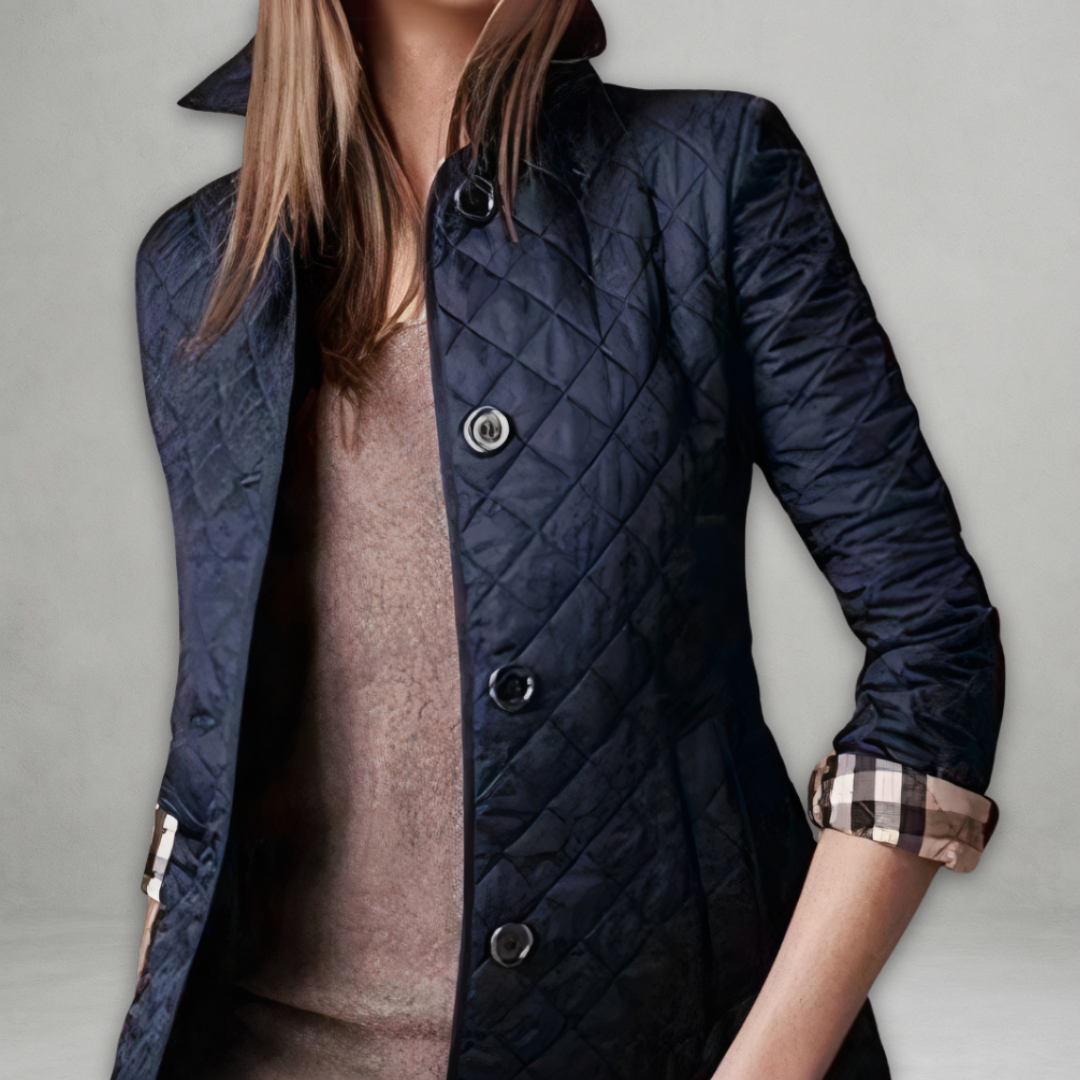 A woman wearing an autumn jacket over a top, layered for a crisp day in town.