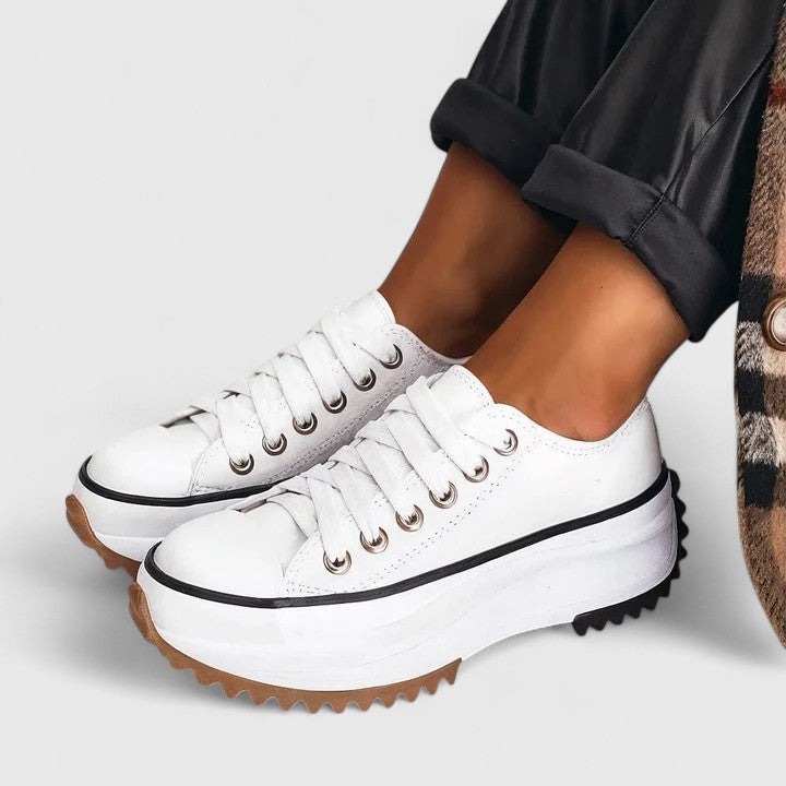 A woman in platform comfort trainers giving a flattering little lift.