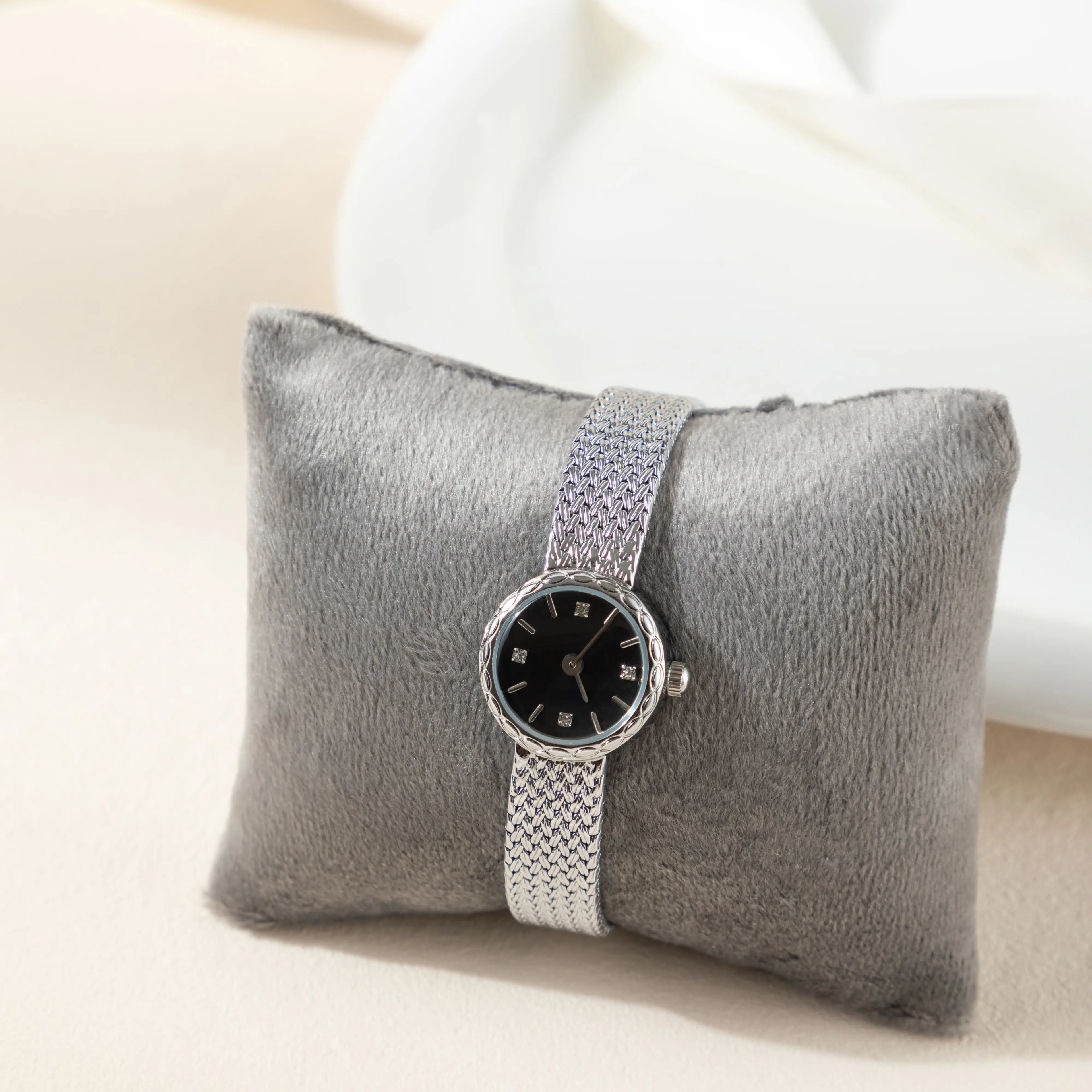 Women's minimalist gold watch with a simple round face and clean gold-tone finish