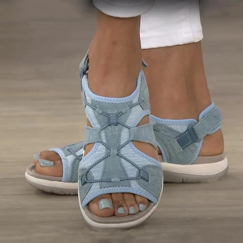 Blue closed sport sandals with adjustable straps and cushioned sole