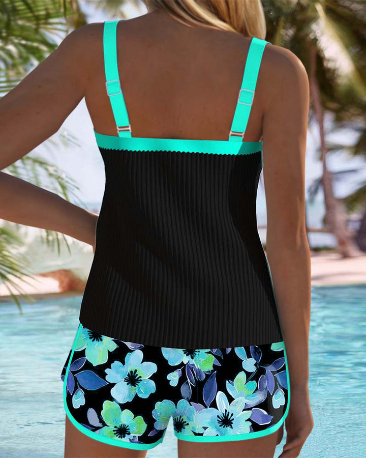 Tankini set with orange tropical-print shorts and matching top