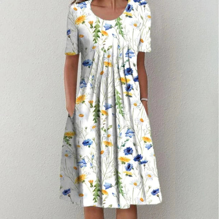 Woman wearing the floral midi dress with pockets, walking outdoors on a sunny day.