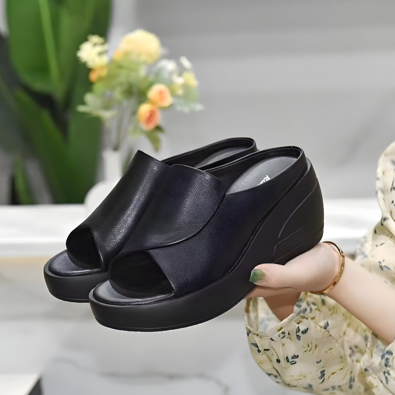 High platform backless sandals in black with a peep-toe front