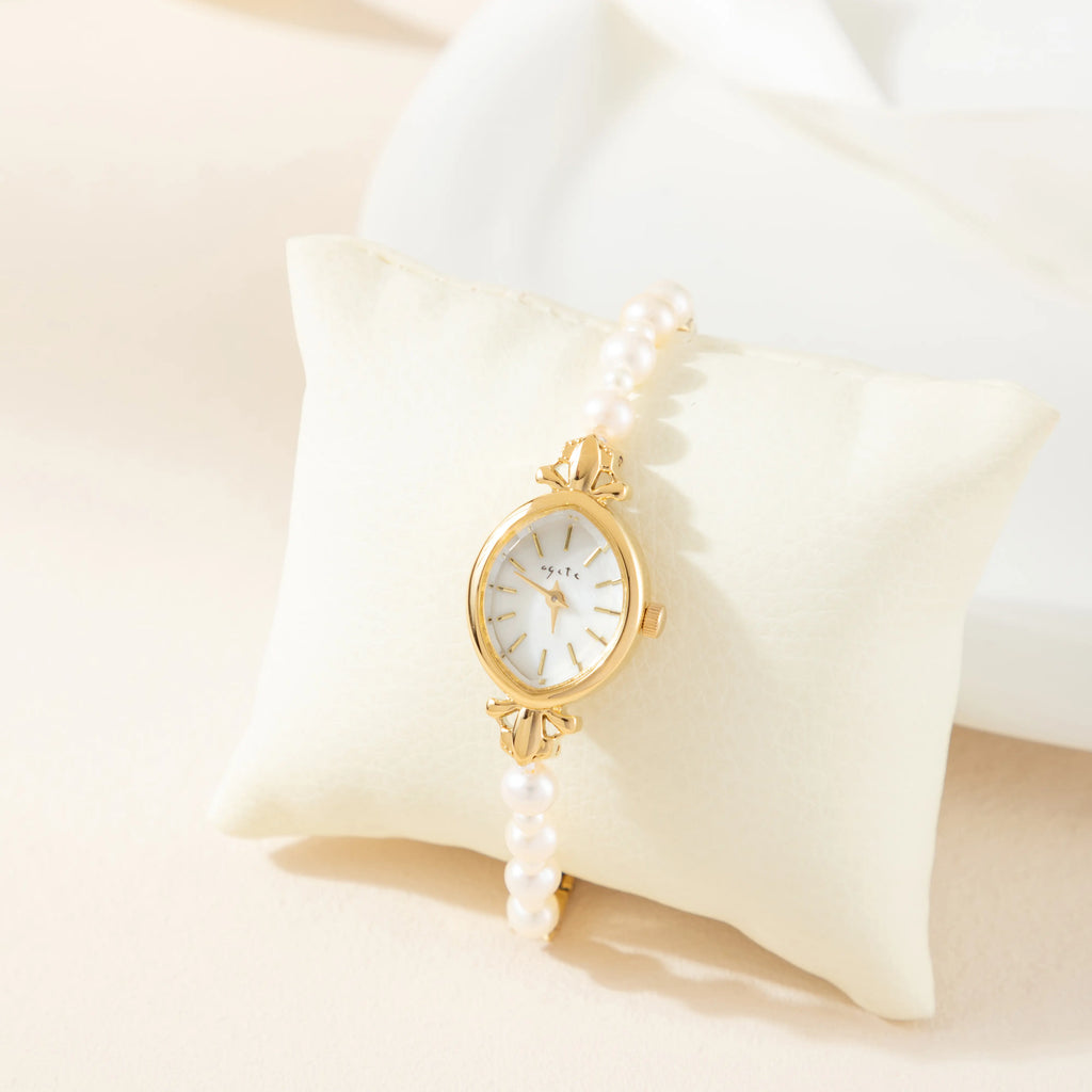 Elegant women's watch with crystal-set dial and delicate golden bracelet strap