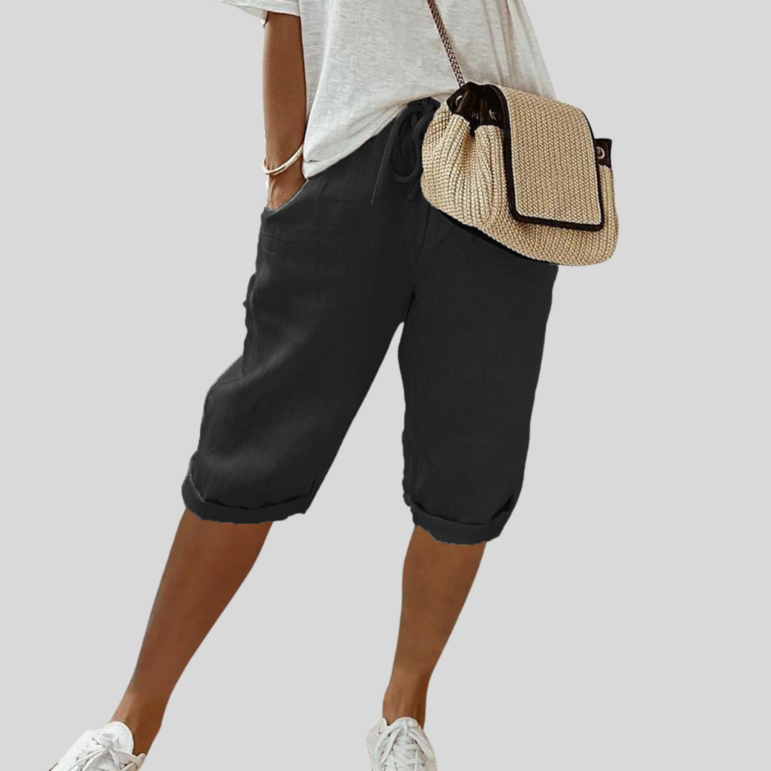 Wide-leg high-waist trousers in a neutral beige tone