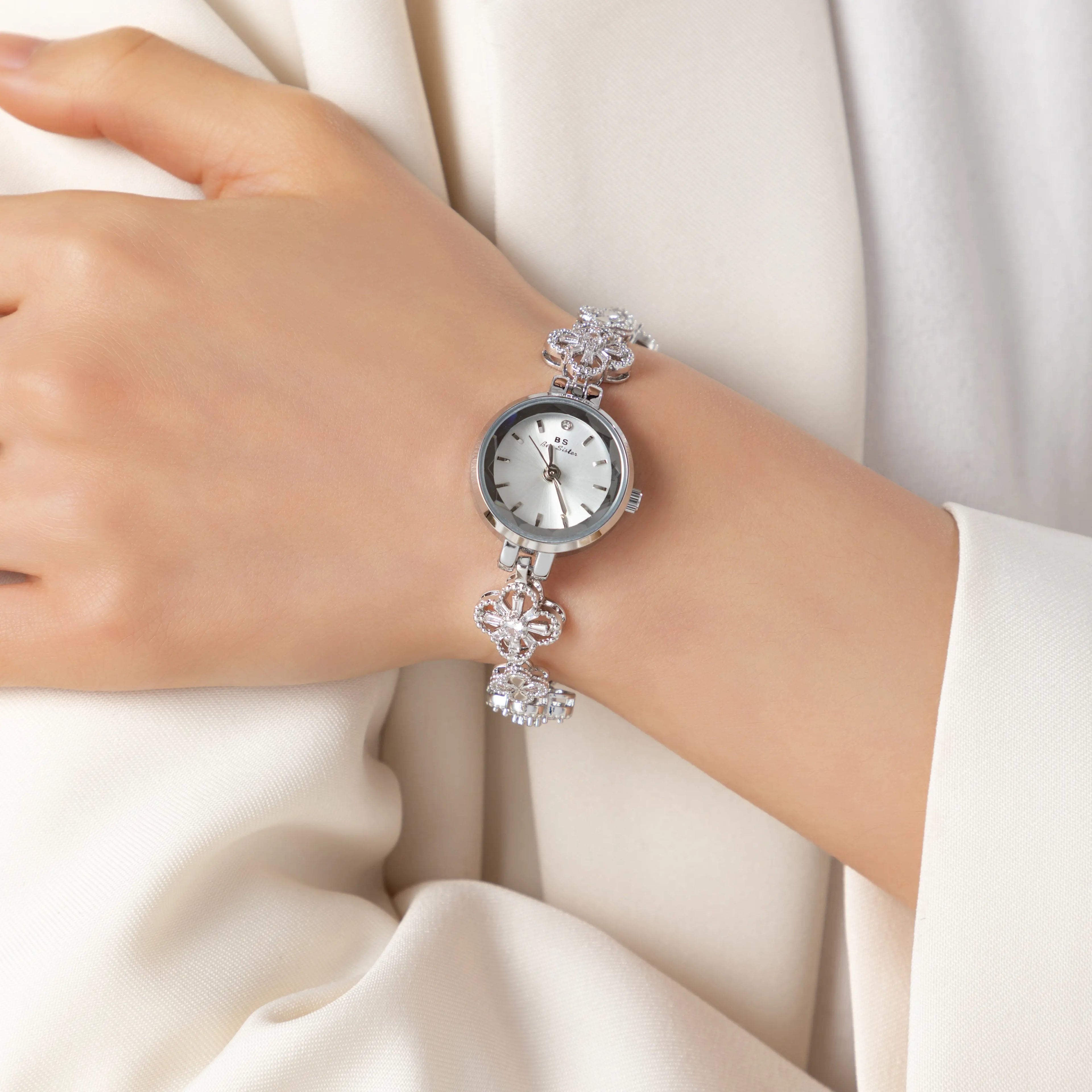 Women's gold-finish watch with rounded design and light-catching detailed face
