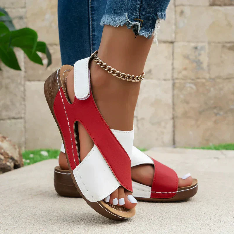 Women's wide-strap daily sandals in navy and white with a low supportive wedge