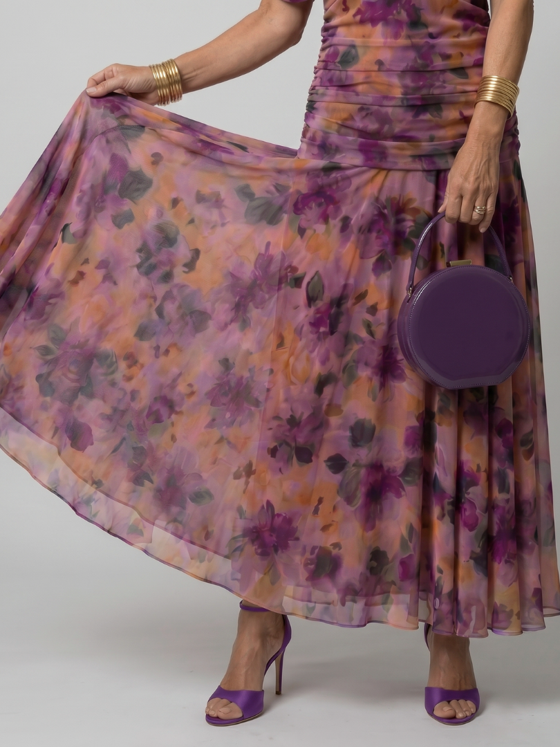 Purple off-shoulder midi dress with draped neckline and gently flared skirt