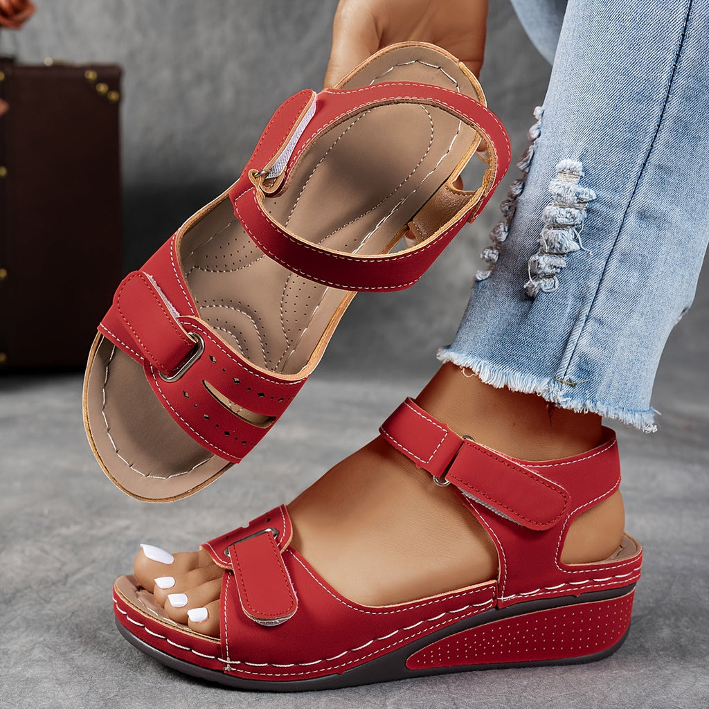 Wedge sandals with three adjustable velcro straps in a warm camel tone