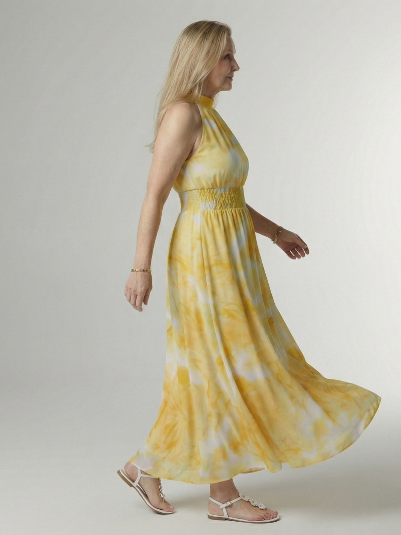 Yellow halter neck midi dress with a ruched waist detail in a clean, simple silhouette