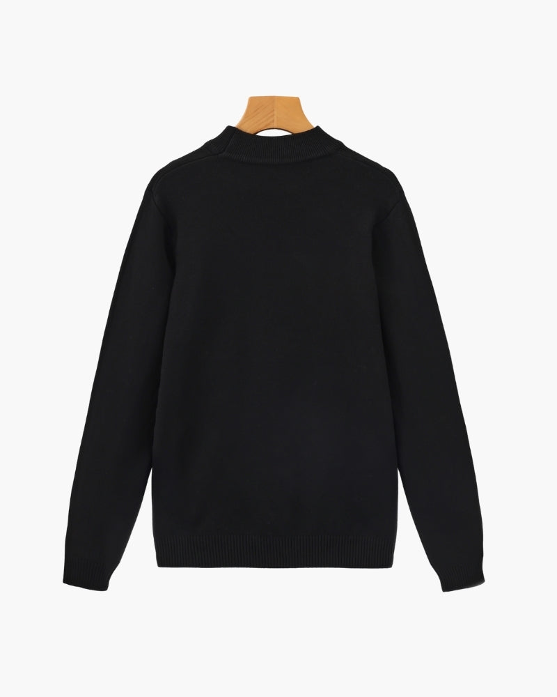 Men's black ribbed roll-neck jumper with a clean structured silhouette