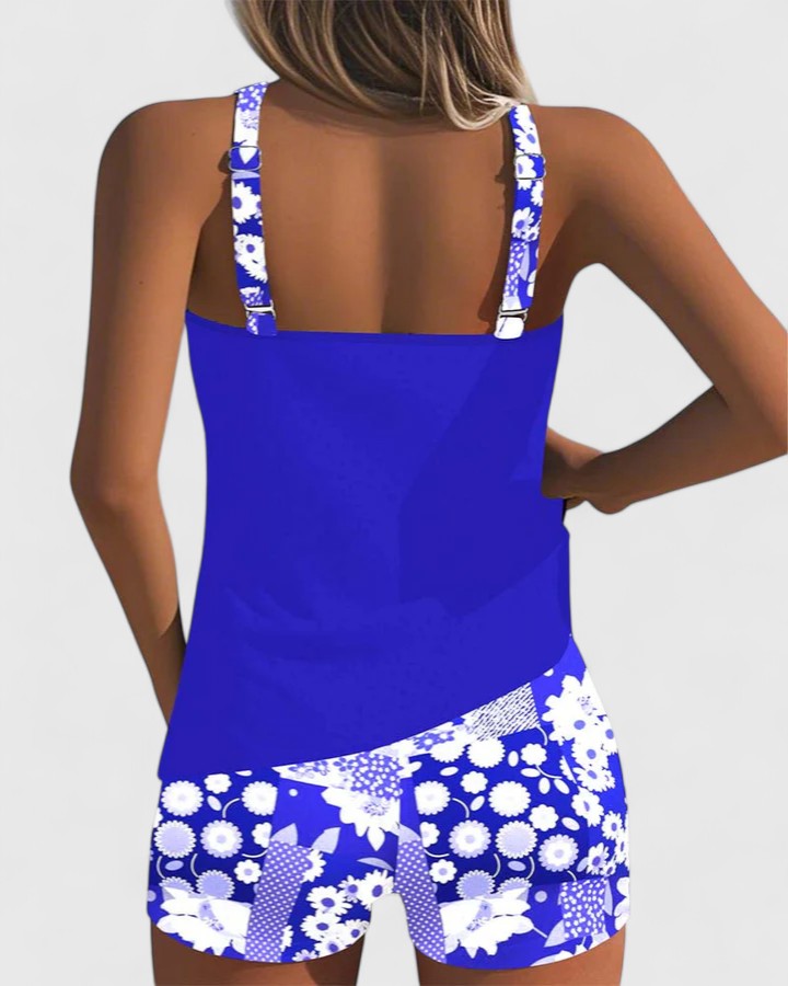 A woman wearing a comfortable swimsuit with a lively print, relaxed and carefree by the pool.