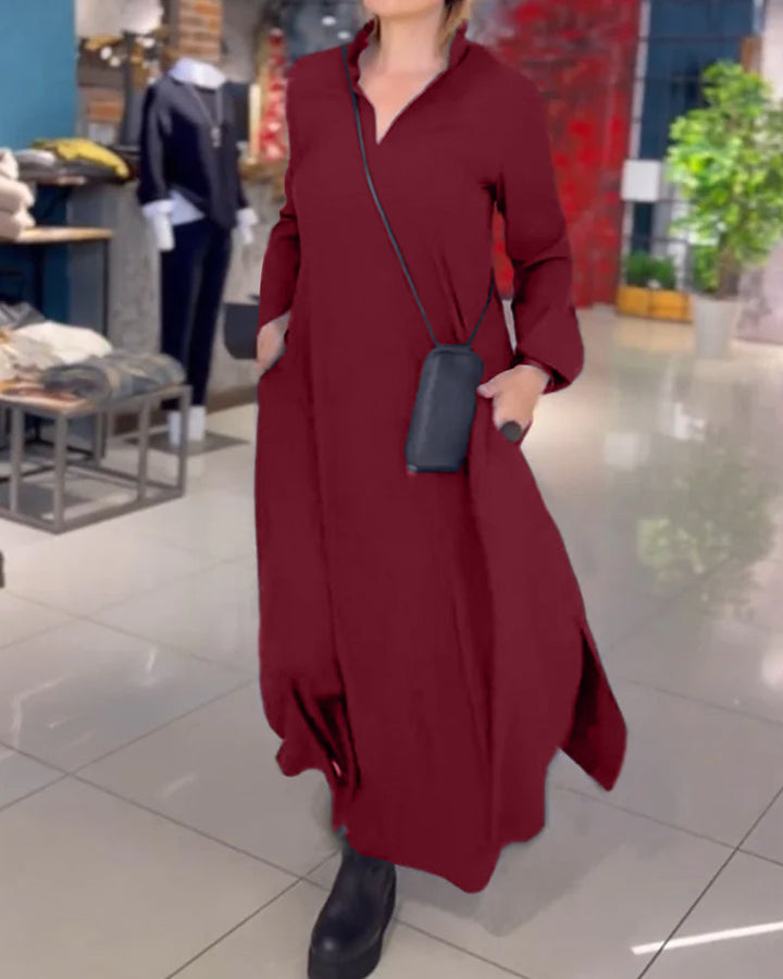 Woman wearing the Sarah relaxed maxi dress with revere collar, standing by a doorway.