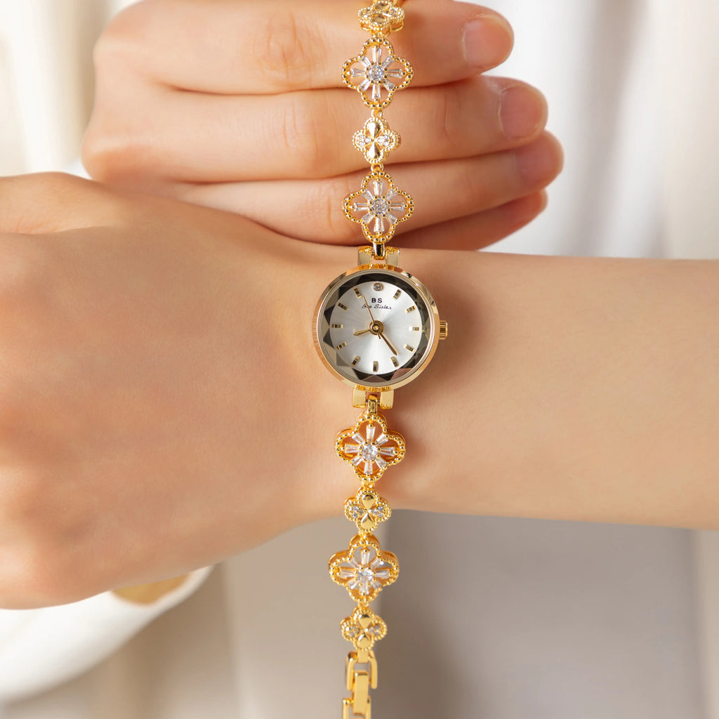 Women's gold-finish watch with rounded design and light-catching detailed face