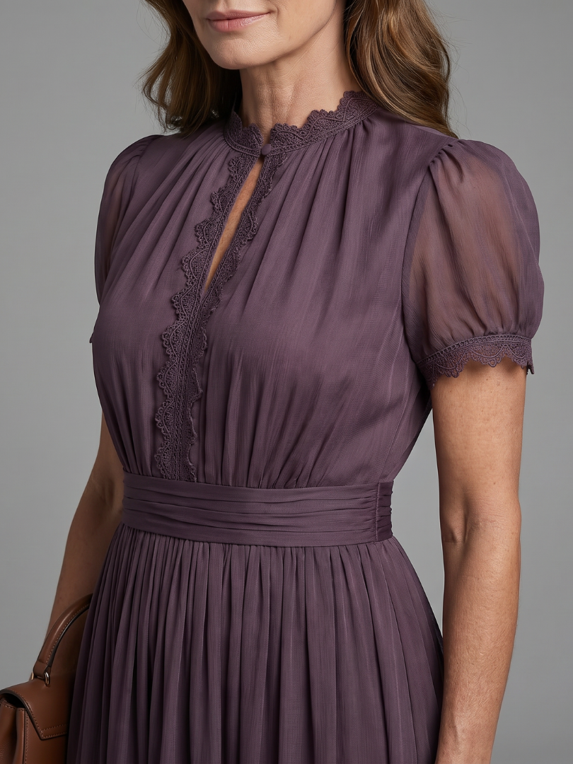 Purple maxi dress with keyhole front neckline, ruched body and flowing skirt