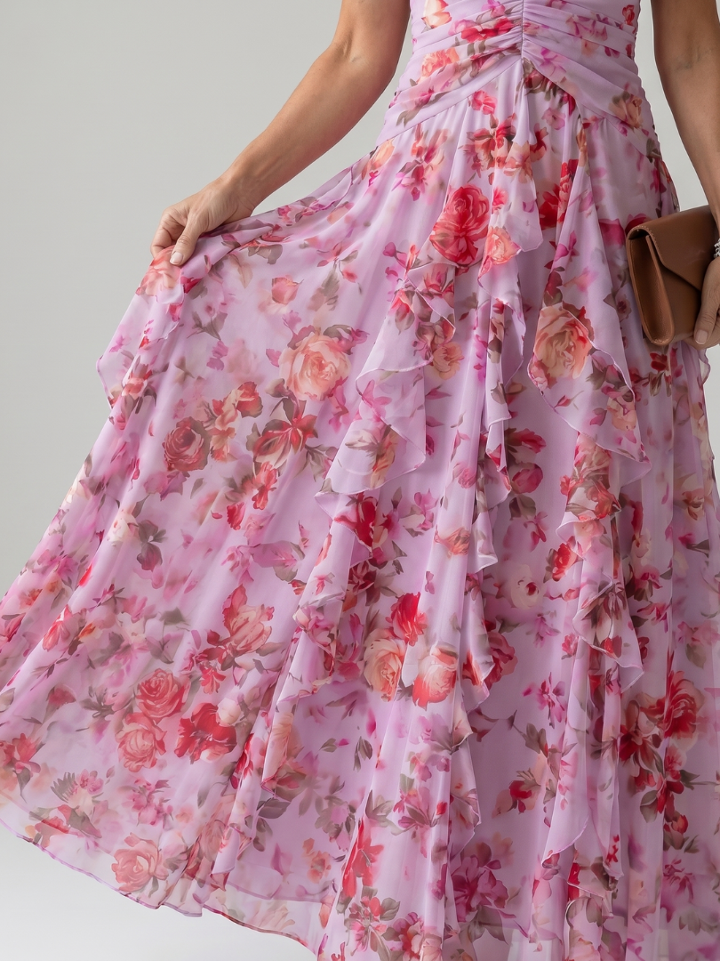 Pink floral halter maxi dress with a ruched bodice and layered ruffle skirt