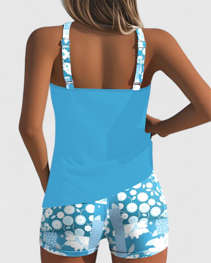 A woman wearing a comfortable swimsuit with a lively print, relaxed and carefree by the pool.