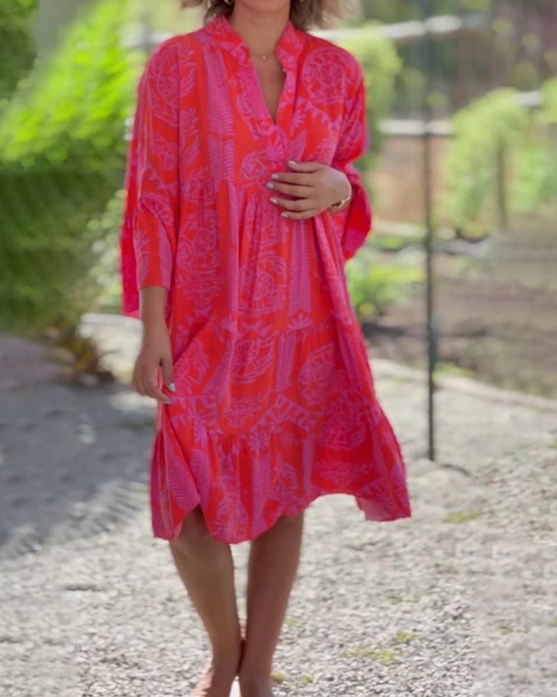 Woman in a loose boho print midi dress enjoying a relaxed day outdoors.