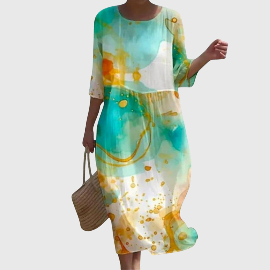 Woman wearing a long flowing maxi dress with a delicate floral print, moving gracefully.