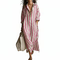 Women's striped maxi dress in pink and white with a classic shirt collar and flowing silhouette