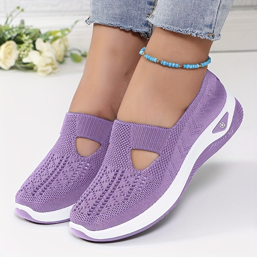 A woman stepping into easy slip-on comfort trainers with no laces.