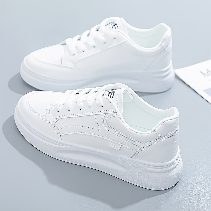 A woman in crisp white light comfort trainers paired with jeans.