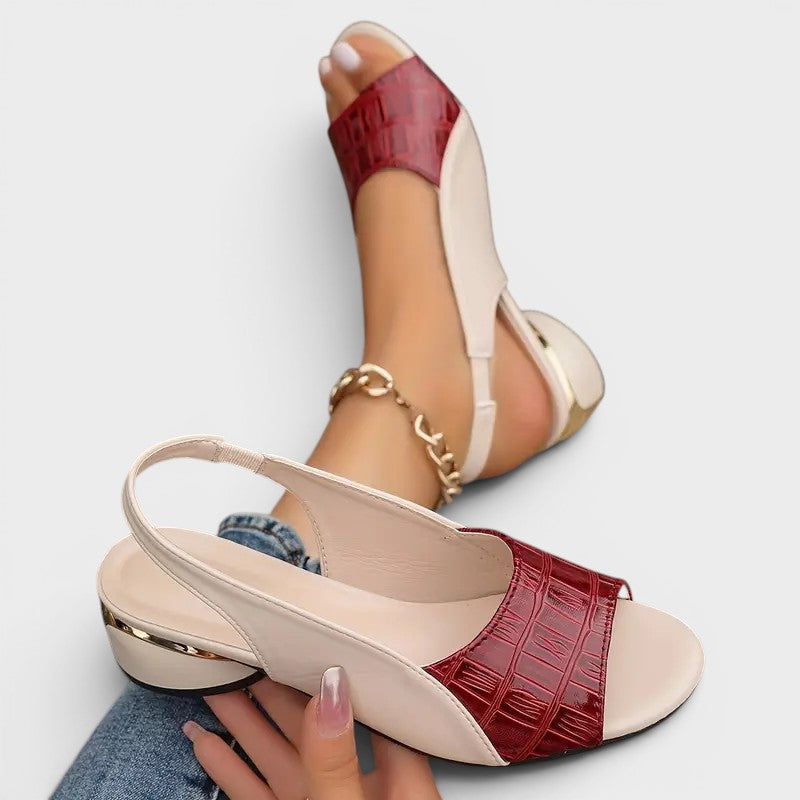 Women's peep-toe wedge sandals in red with an open toe and secure ankle strap