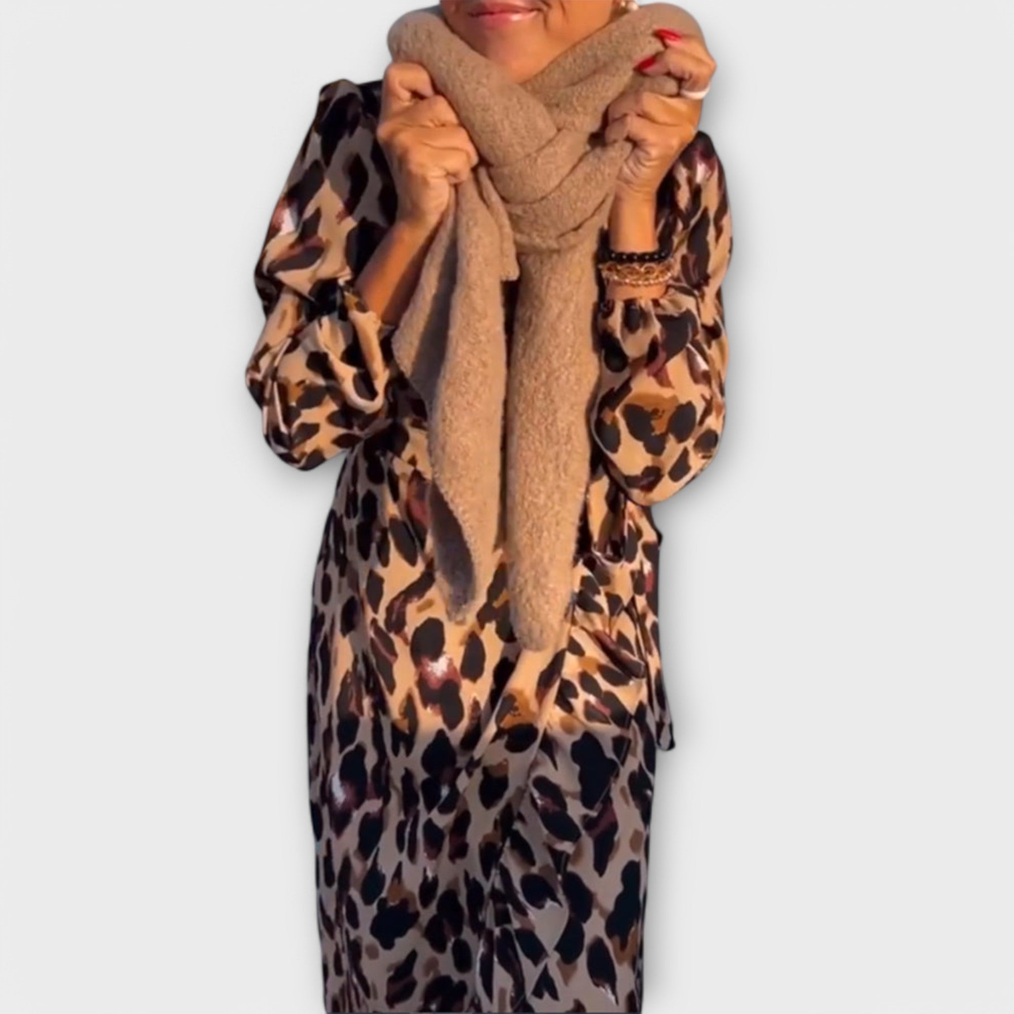 Leopard print wrap-style dress with V-neckline and adjustable waist tie