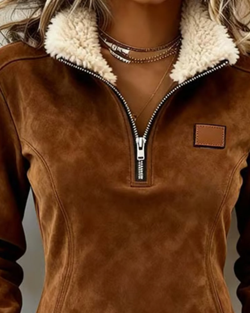 Women's half-zip sweatshirt with a soft inner lining and decorative hem detail