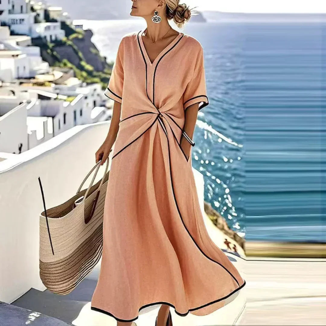 Women's waist-defining dress in blue with a draped front detail and flowy skirt