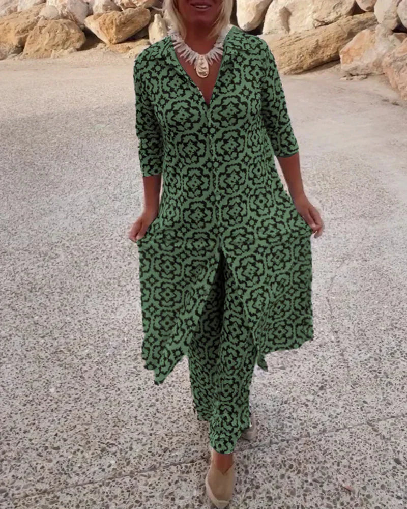 A woman standing confidently in a coordinated geometric-print top and matching trousers.