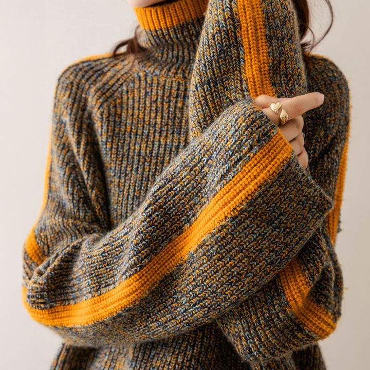 A woman wearing a softly textured everyday jumper with a relaxed modern line.