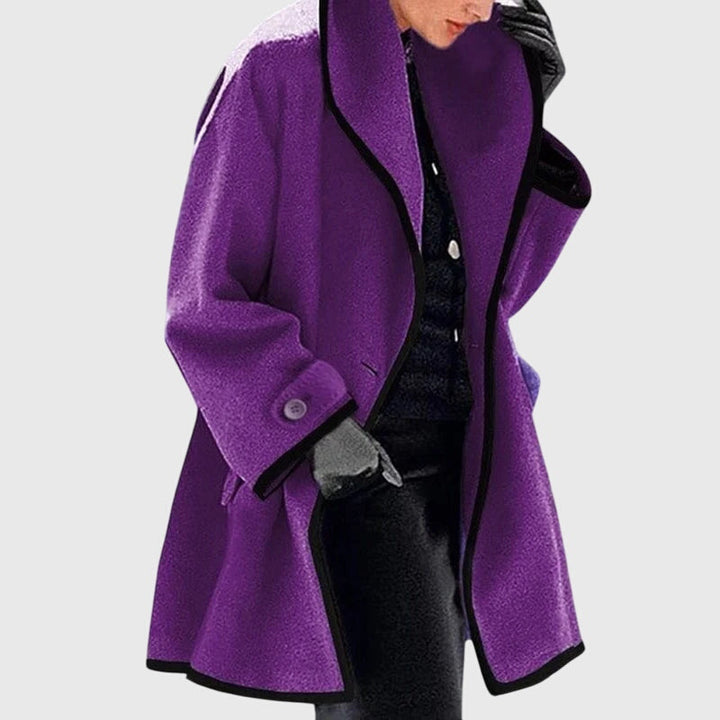 A woman wearing a double-breasted buttoned jacket on a cold day